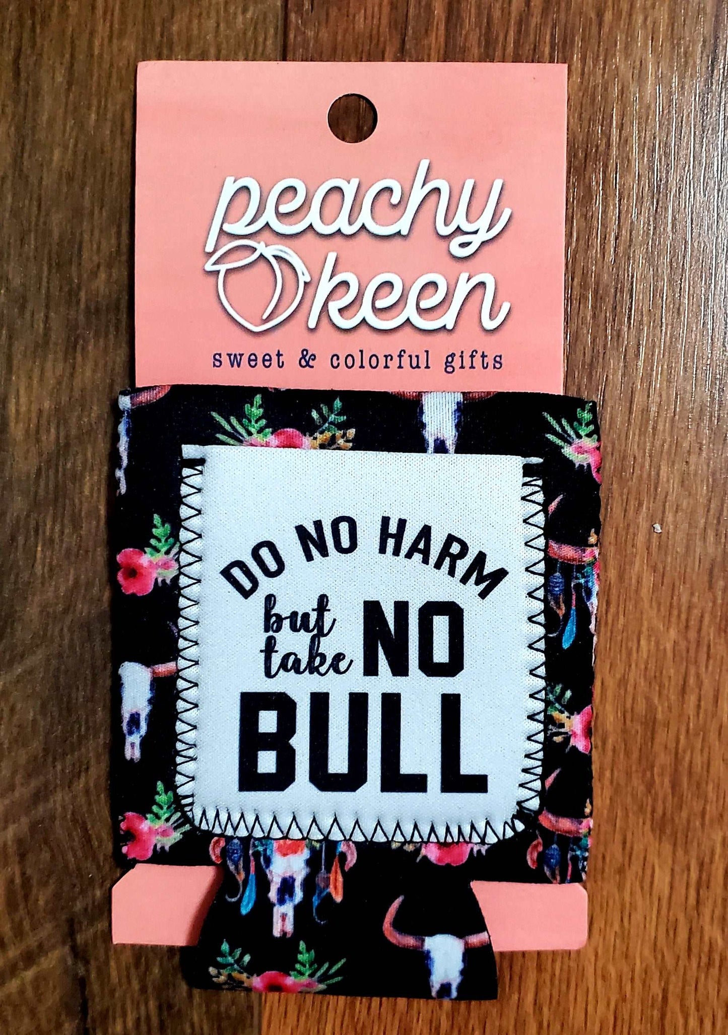 Black floral and bull skull can cooler with the words do no harm but take no bull.