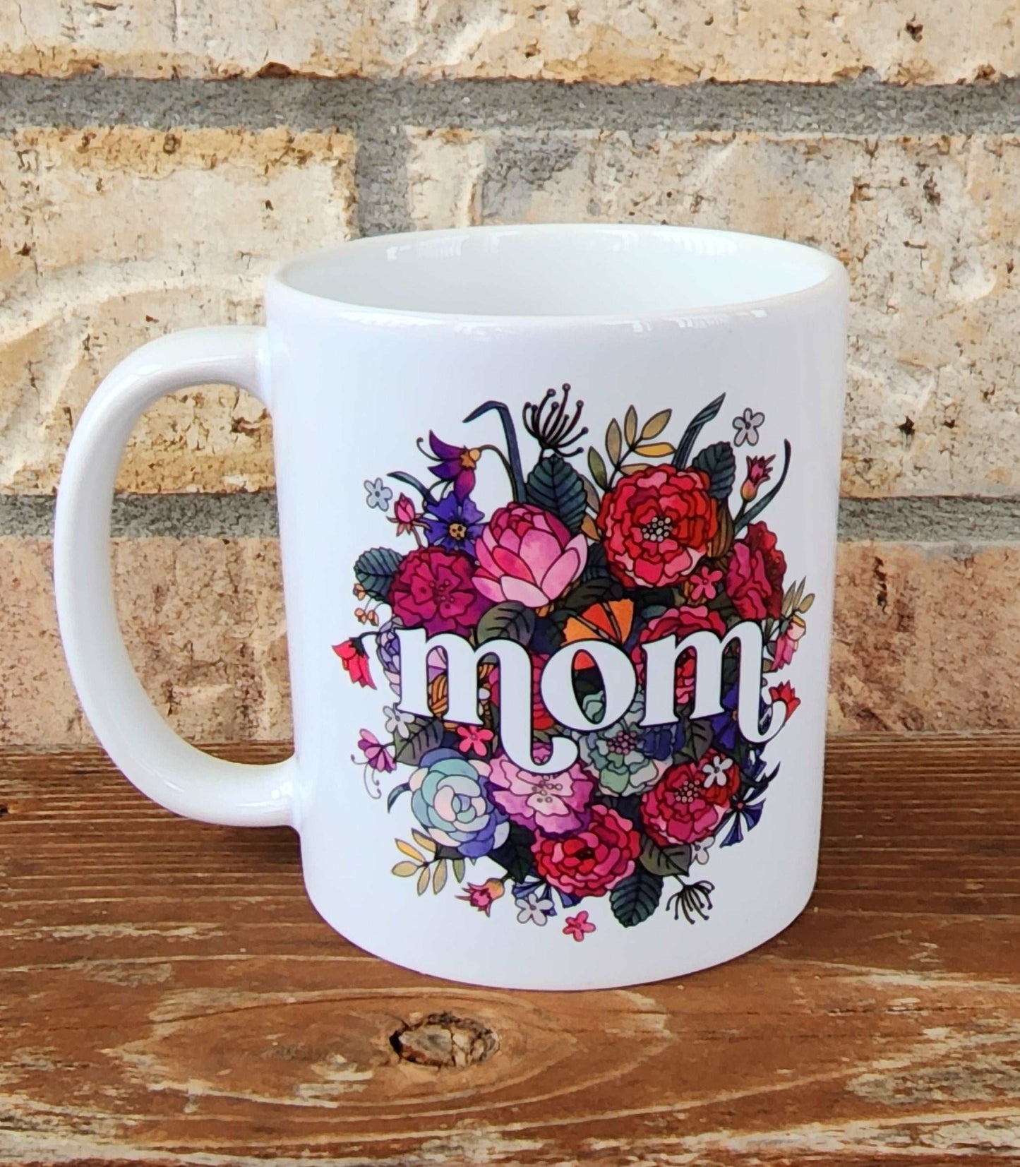White floral mug with Mom on it.