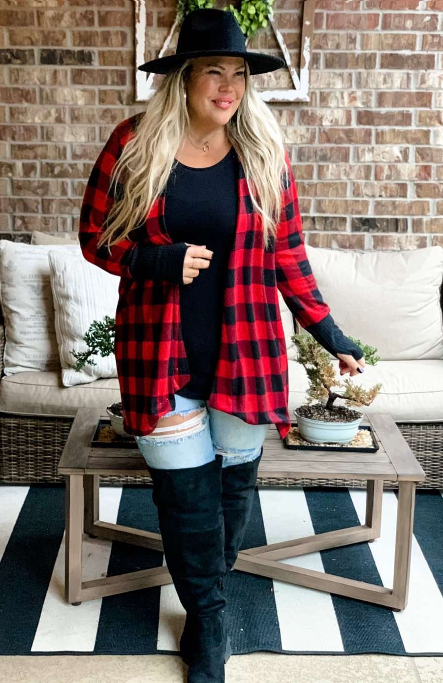 Buffalo plaid cardigan with thumb holes.