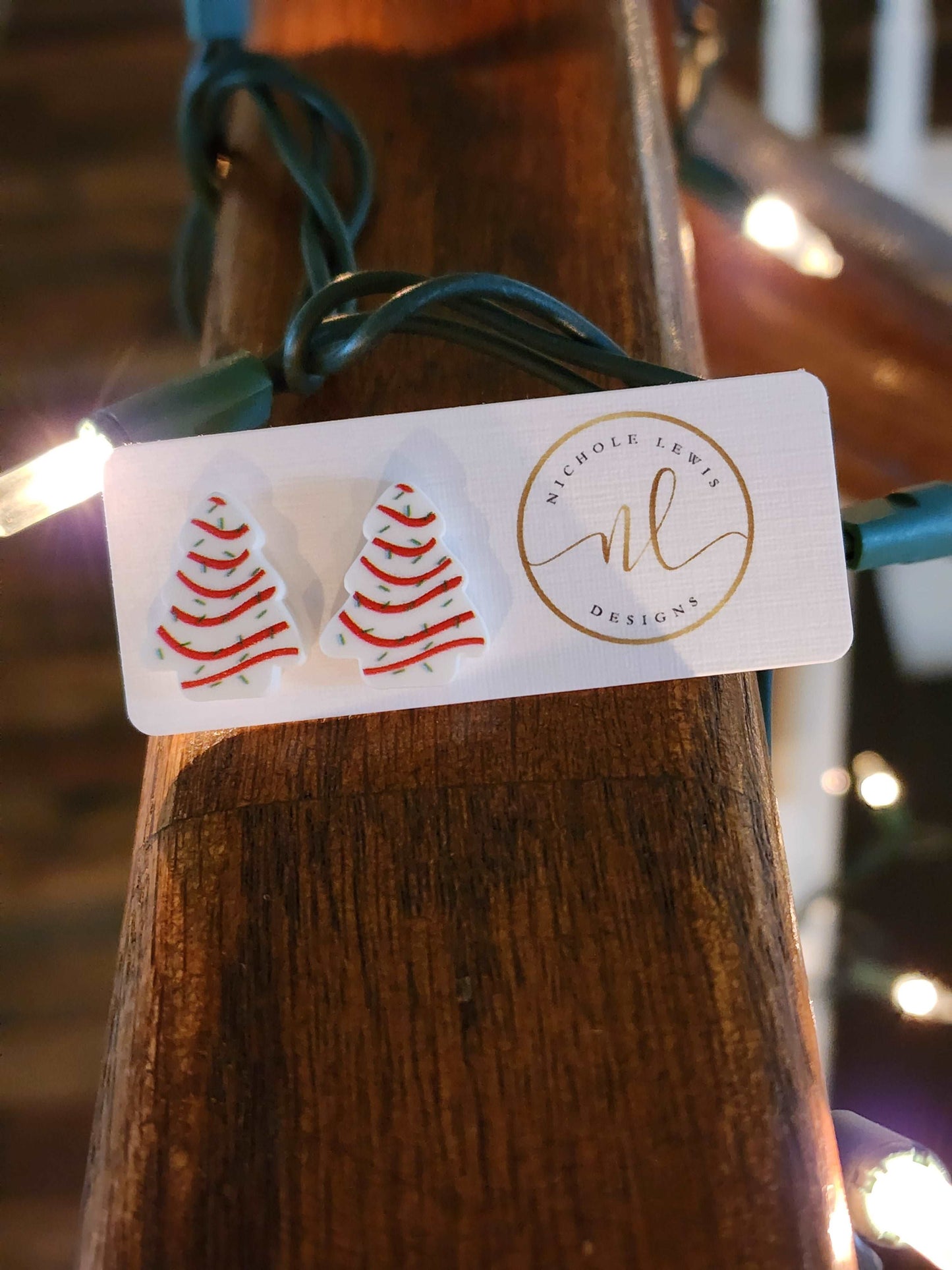 Earrings shaped like Christmas tree cakes.