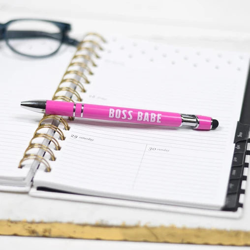 Black ink pen in the color pink with the words Boss Babe on it.