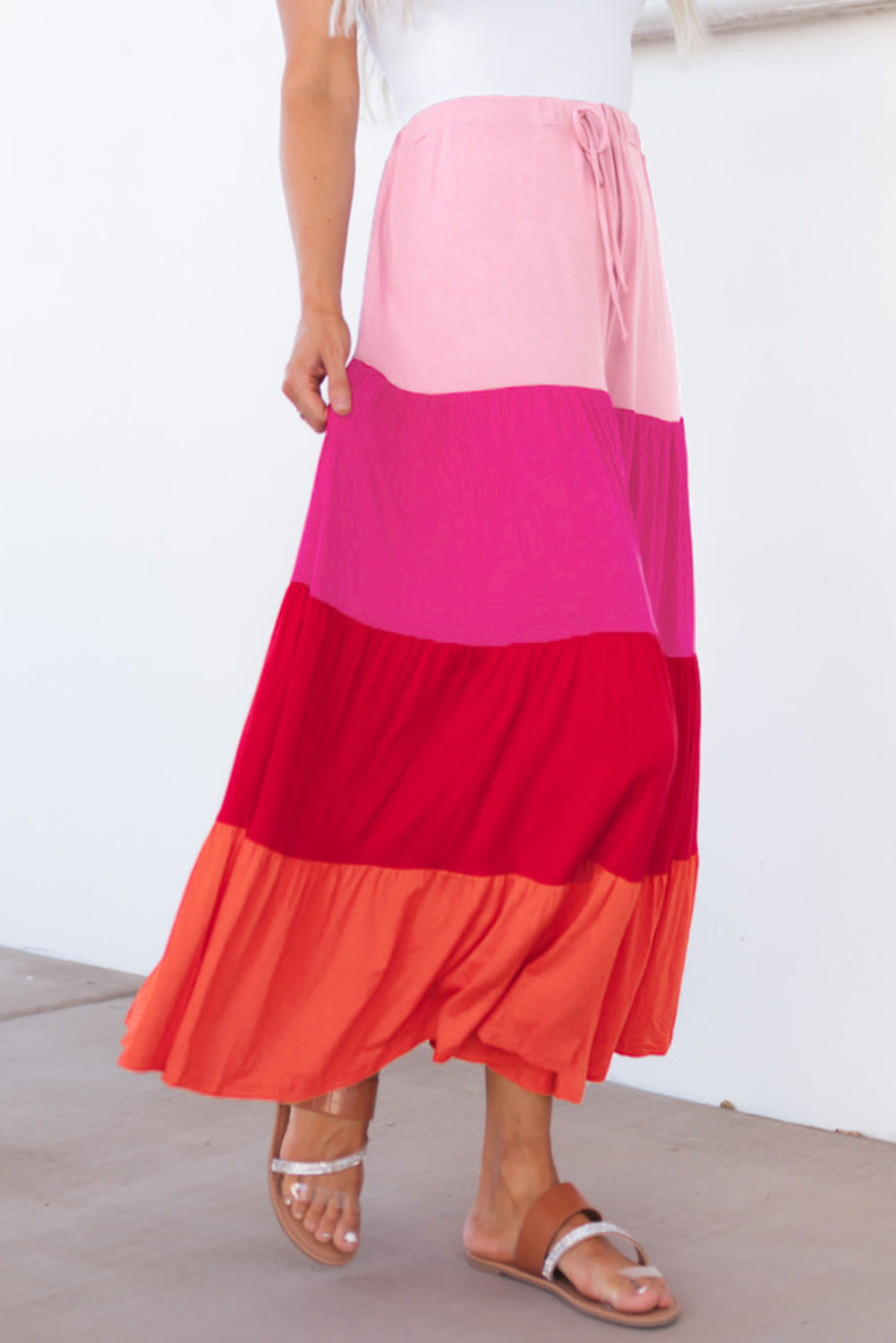 Light pink, hot pink, red, coral tiered skirt. Drawstring elastic waist.