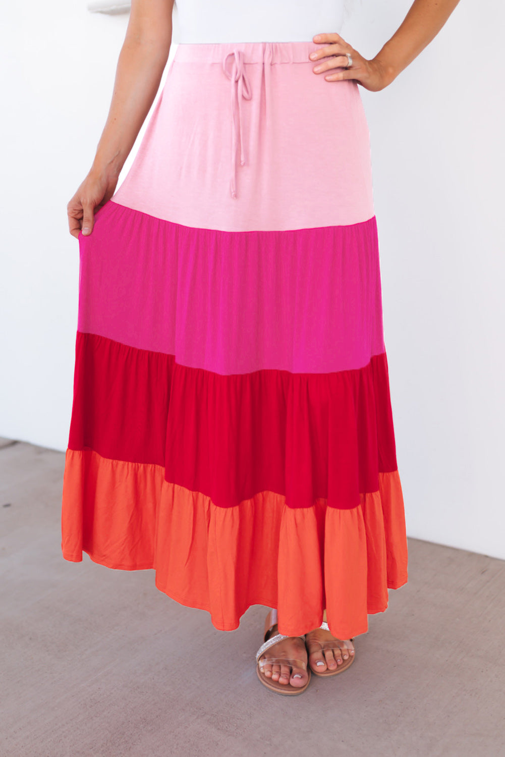 Light pink, hot pink, red, coral tiered skirt. Drawstring elastic waist.